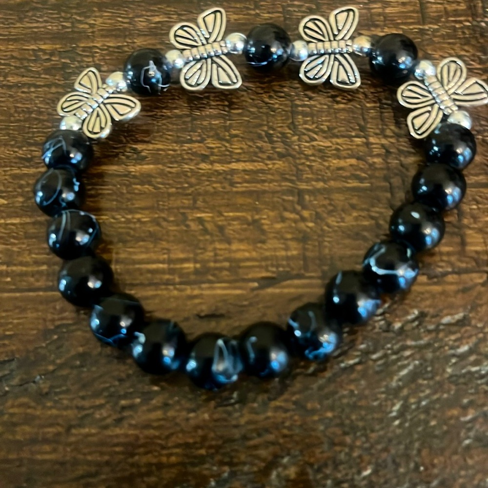 Black glass bead butterfly collection. we are out or give us a gift.